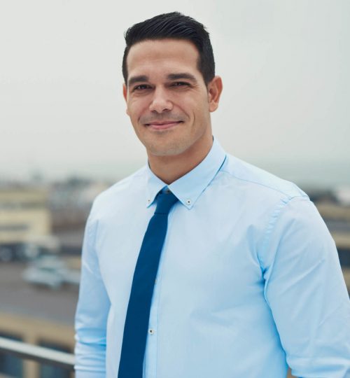 smiling-relaxed-hispanic-businessman-MLREA79