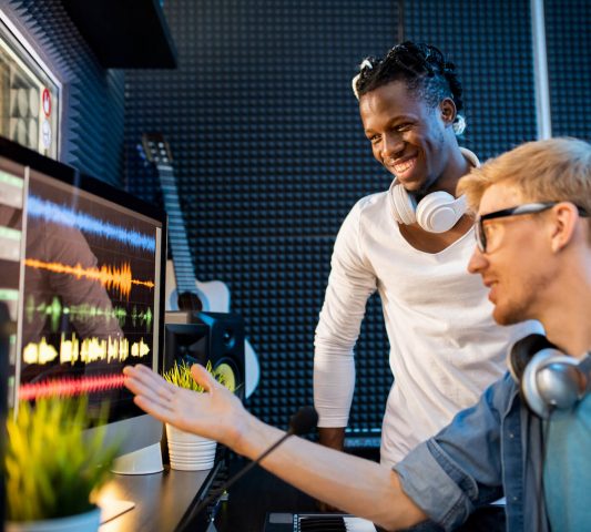 young-musician-or-producer-showing-african-man-gro-ZNGU3XD