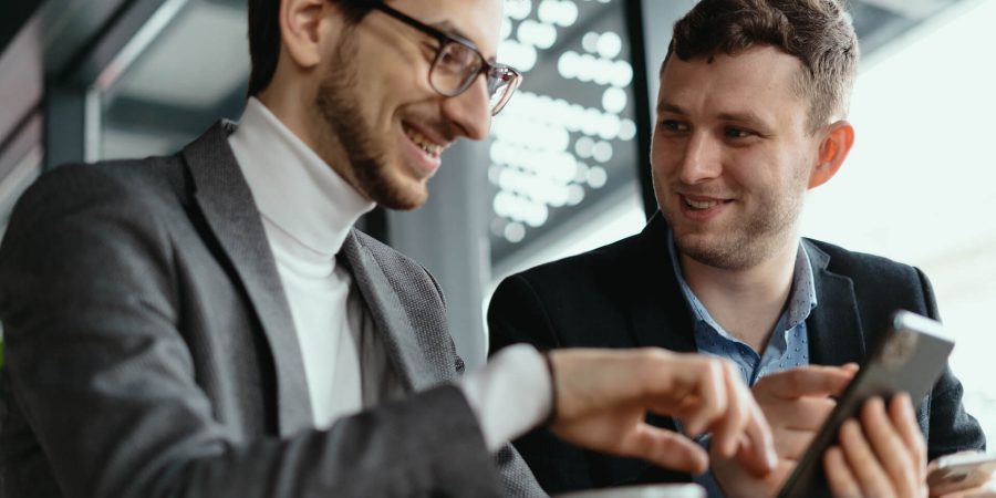 two-businessmen-having-a-conversation-using-a-smar-2021-08-28-12-41-57-utc