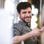 happy-businessman-using-mobile-phone-2021-08-28-18-33-21-utc
