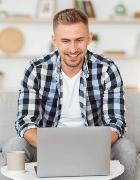 happy-man-chatting-online-on-laptop-with-friend-at-2021-08-29-10-33-36-utc