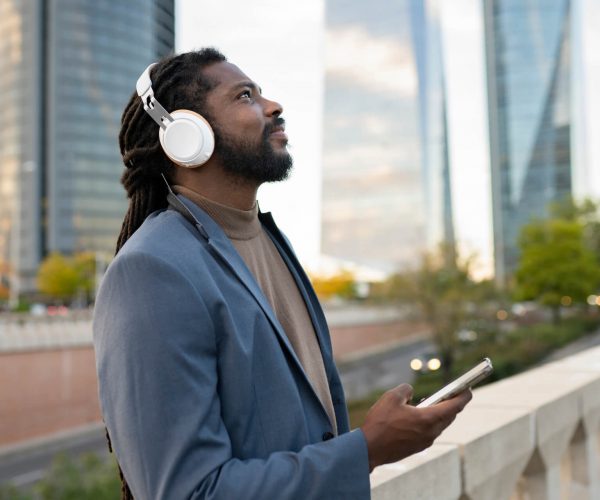 business-man-listening-to-music-in-the-city-2022-02-02-20-10-10-utc