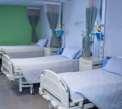 front-view-of-row-of-empty-hospital-beds-in-hospit-2021-08-28-16-43-57-utc-Custom-Custom