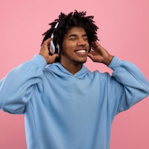 attractive-black-teen-guy-in-casual-wear-listening-2022-01-30-08-42-49-utc