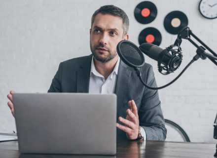 handsome-radio-host-gesturing-while-speaking-in-mi-2021-09-15-00-45-32-utc