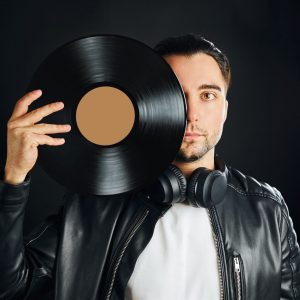 music-vinyl-record-man-holding-black-vinyl-record-2022-08-01-04-33-21-utc