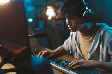 teenager-wearing-headphones-and-playing-online-vid-2022-01-19-00-21-34-utc