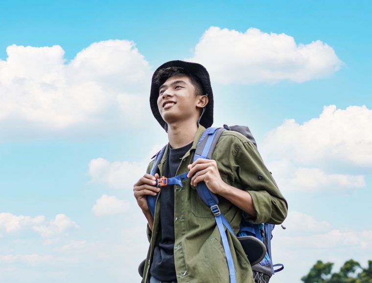young-asian-man-traveler-with-backpack-in-reservoi-2021-08-30-15-39-48-utc